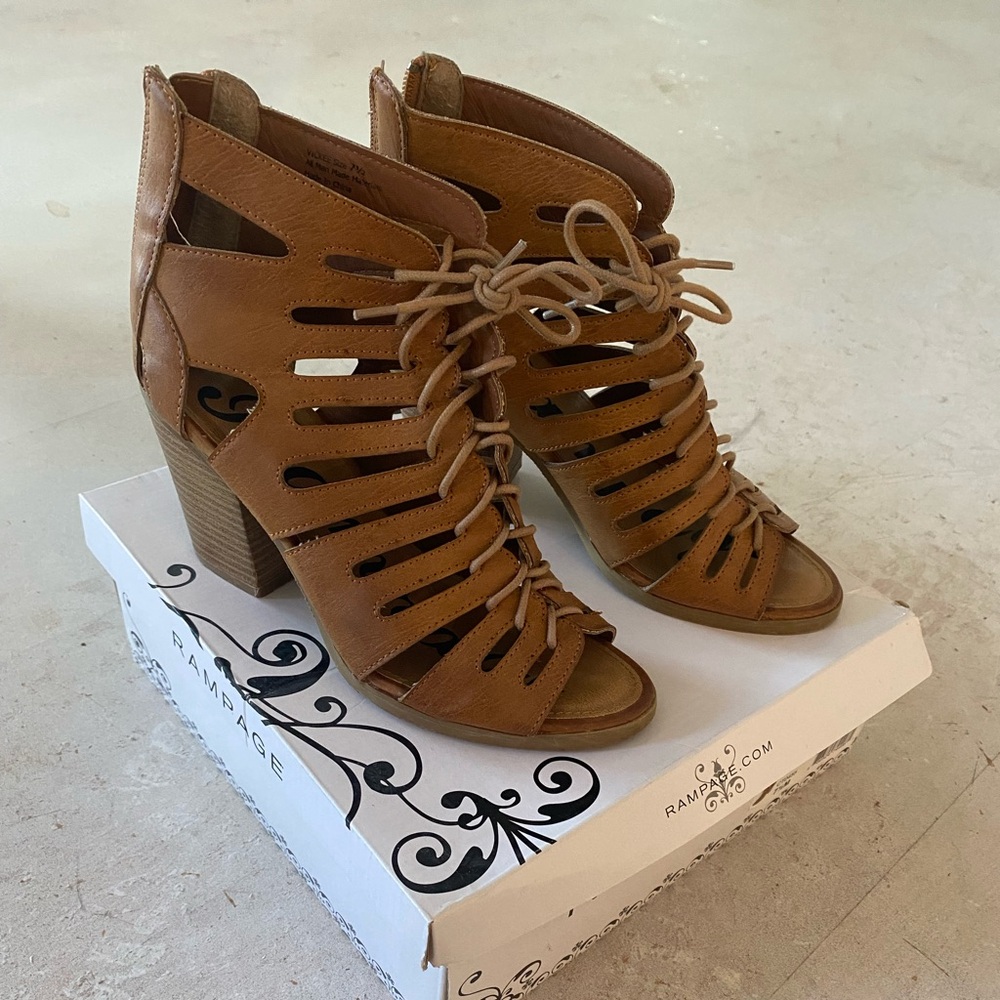 Brown heeled open toe sandals.
